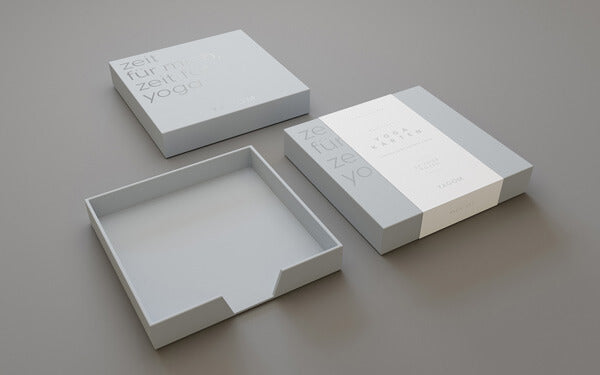 Graue Box mit individuell gestaltbarer Banderole und hochwertiger Prägung.